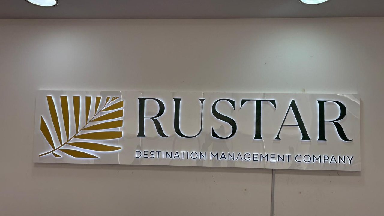 Dimensional lettering and a logo on an illuminated indoor sign.