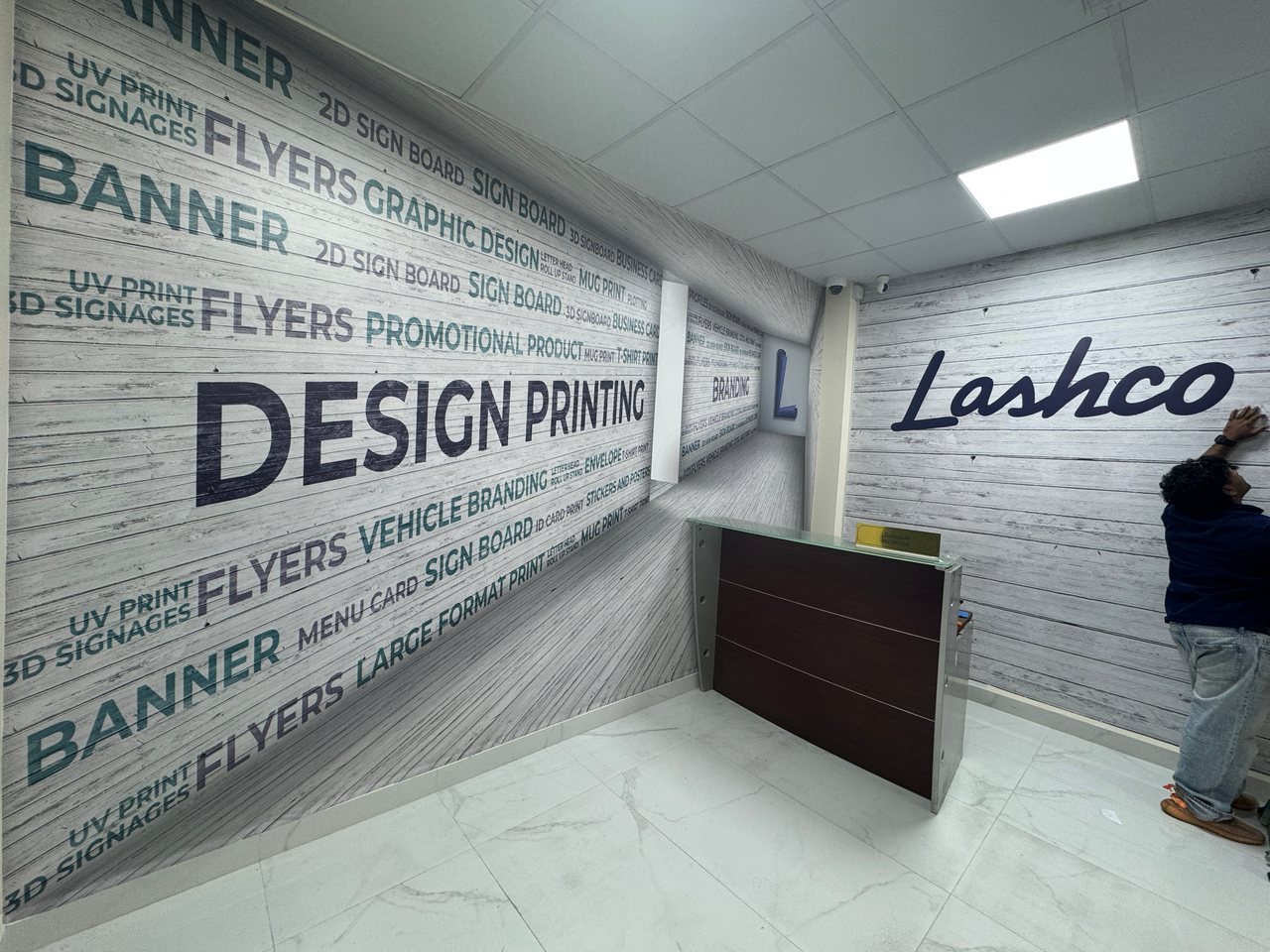 Printed wall graphics and Lashco lettering inside the office.